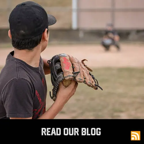 Latinx youth sports baseball player winding up to pitch to the catcher during a baseball game