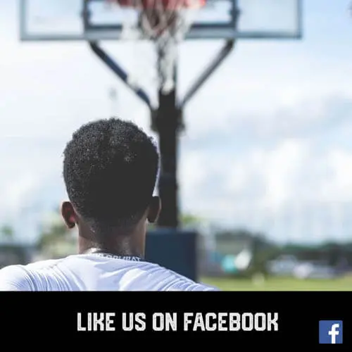 African American teenage boy youth sports basketball player shooting hoops on an outside court
