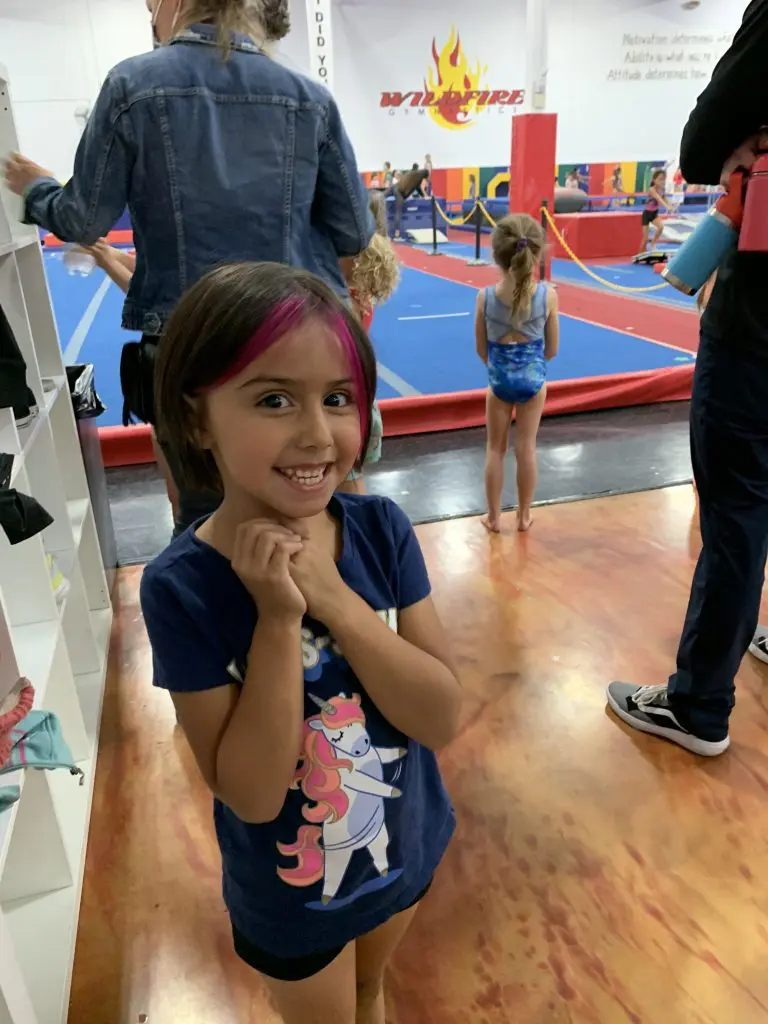 Young female gymnast athlete at gymnastics class with All Kids Play's youth sports financial assistance grant