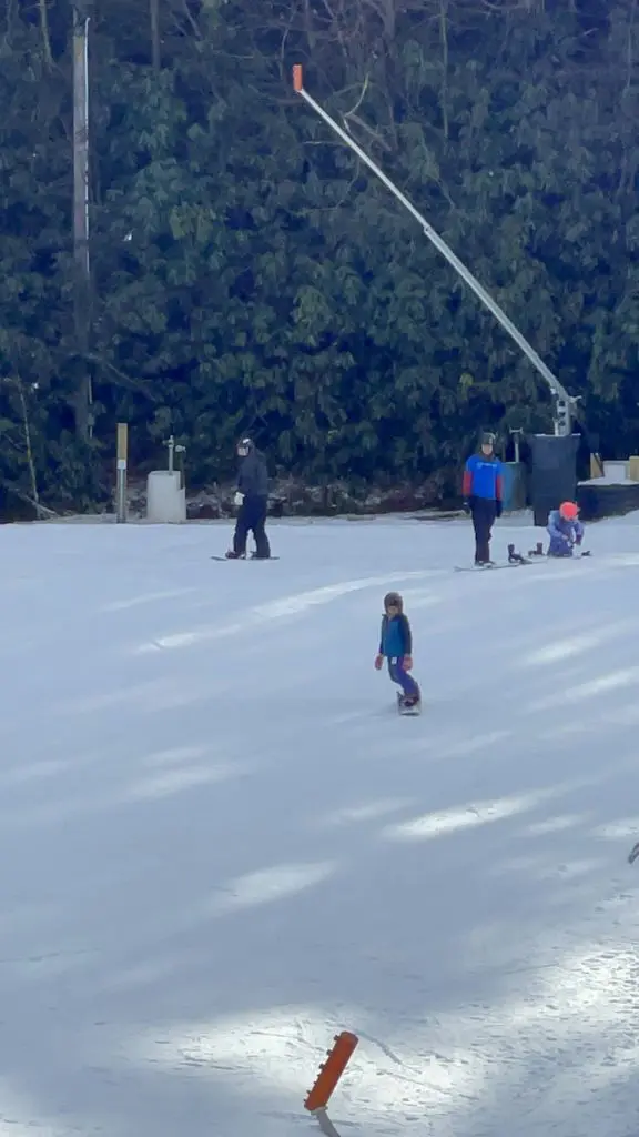 Flynn Boone snowboarding at Cataloochee Ski Area with an All Kids Play youth sports grant
